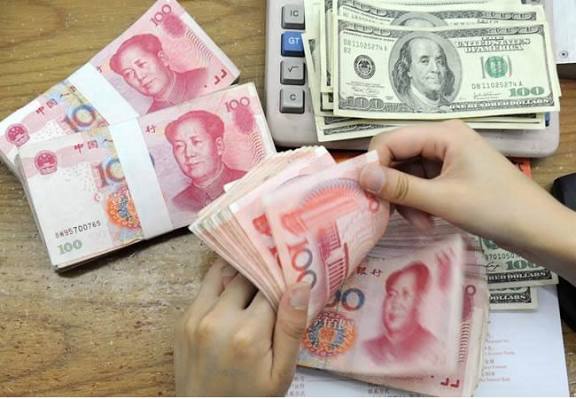 Yuan weakens to 7.1056 against dollar